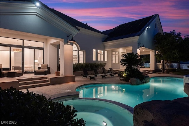 1610 Brock Ct, Las Vegas, NV 89117 - view of pool with a patio, a pool with connected hot tub, and an outdoor hangout area