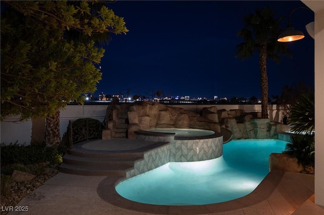 1610 Brock Ct, Las Vegas, NV 89117 - pool at night with a pool with connected hot tub