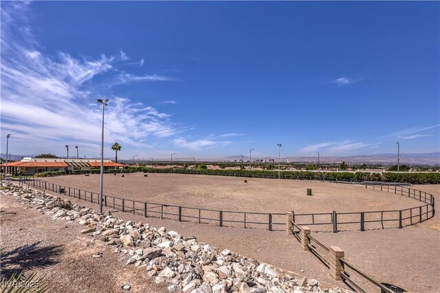 1157 Morning Sun Way, Las Vegas, NV 89110 - surrounding community featuring a view of countryside, an enclosed horse arena, a mountain view, and fence