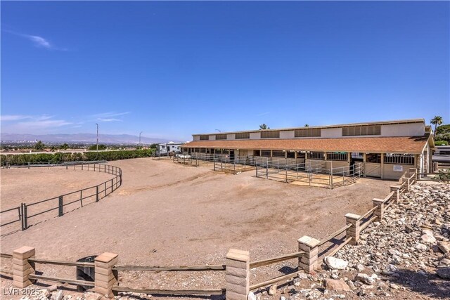 1157 Morning Sun Way, Las Vegas, NV 89110 - view of home's community featuring an exterior structure, an outdoor structure, a mountain view, and a rural view