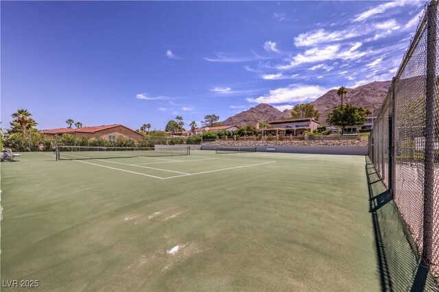 1157 Morning Sun Way, Las Vegas, NV 89110 - view of tennis court with a mountain view and fence