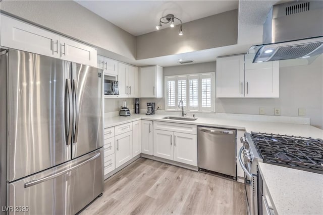 1157 Morning Sun Way, Las Vegas, NV 89110 - kitchen with stainless steel appliances, a sink, range hood, and light countertops