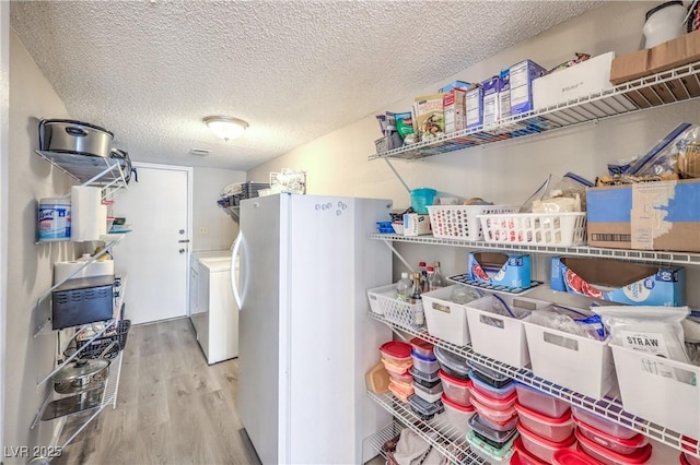 1157 Morning Sun Way, Las Vegas, NV 89110 - laundry room with washer / clothes dryer, wood finished floors, and a textured ceiling