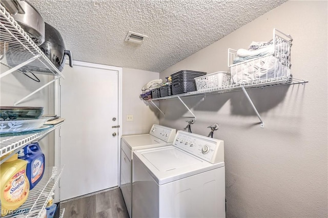 1157 Morning Sun Way, Las Vegas, NV 89110 - laundry room with washer and dryer, wood finished floors, and a textured ceiling