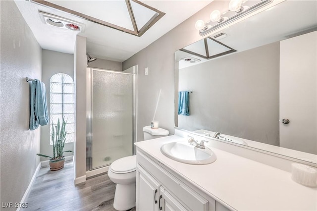 1157 Morning Sun Way, Las Vegas, NV 89110 - full bath featuring wood finished floors, a shower stall, toilet, and a skylight