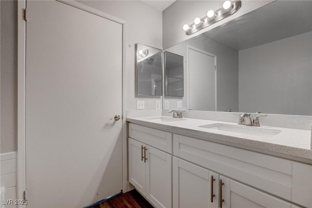 7905 Idledale Ct Unit 102, Las Vegas, NV 89145 - bathroom featuring double vanity and wood finished floors