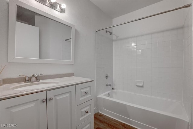 7905 Idledale Ct Unit 102, Las Vegas, NV 89145 - full bathroom with wood finished floors, vanity, and  shower combination