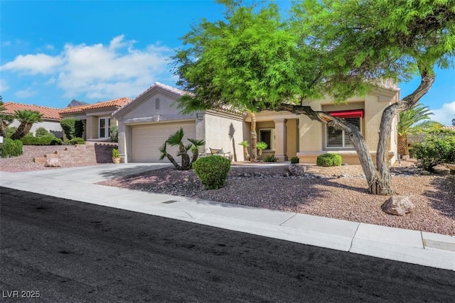 10532 Sea Palms Ave, Las Vegas, NV 89134 - view of front of property with stucco siding, a garage, and driveway