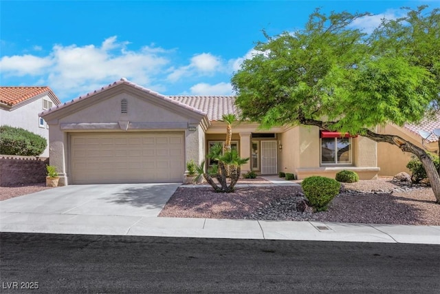 10532 Sea Palms Ave, Las Vegas, NV 89134 - view of front facade with stucco siding, an attached garage, concrete driveway, and a tiled roof