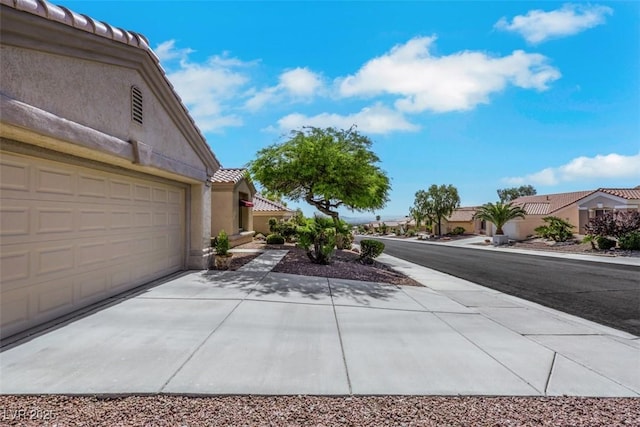 10532 Sea Palms Ave, Las Vegas, NV 89134 - view of yard with driveway and a garage