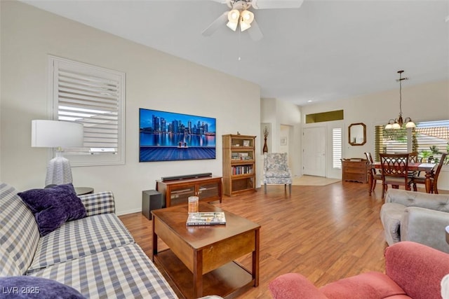 10532 Sea Palms Ave, Las Vegas, NV 89134 - living room with ceiling fan, light wood-style flooring, and a chandelier