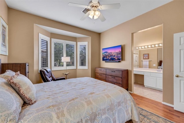 10532 Sea Palms Ave, Las Vegas, NV 89134 - bedroom featuring light wood finished floors, connected bathroom, and ceiling fan