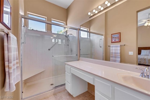 10532 Sea Palms Ave, Las Vegas, NV 89134 - ensuite bathroom featuring a shower stall, vanity, a ceiling fan, and tile patterned floors