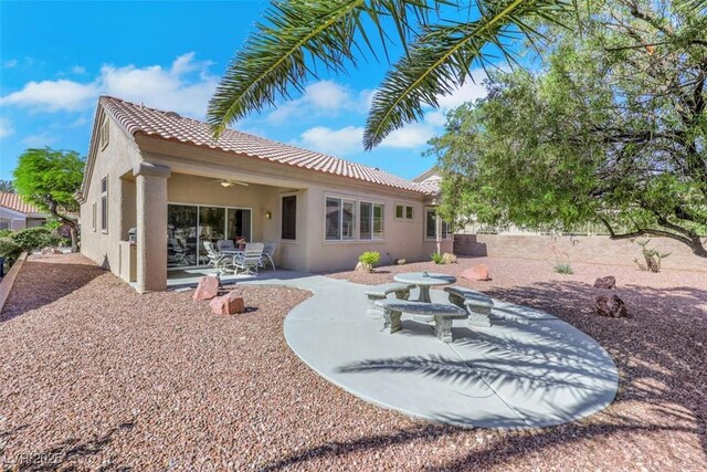 10532 Sea Palms Ave, Las Vegas, NV 89134 - rear view of house featuring stucco siding, a tile roof, a patio area, and ceiling fan