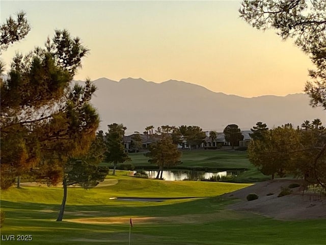 10532 Sea Palms Ave, Las Vegas, NV 89134 - view of community with golf course view, a water and mountain view, and a lawn