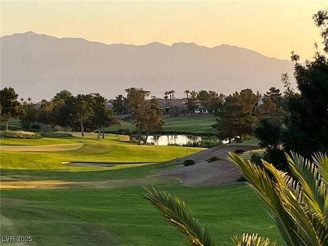 10532 Sea Palms Ave, Las Vegas, NV 89134 - view of home's community featuring golf course view, a water and mountain view, and a lawn