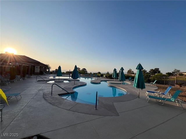 10532 Sea Palms Ave, Las Vegas, NV 89134 - pool at dusk featuring a patio and a community pool