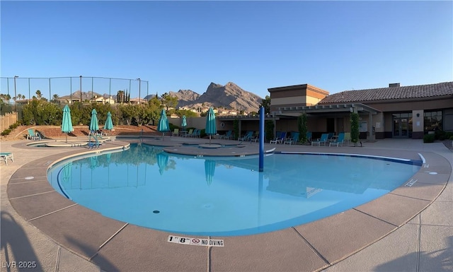 10532 Sea Palms Ave, Las Vegas, NV 89134 - community pool with a patio area and a mountain view