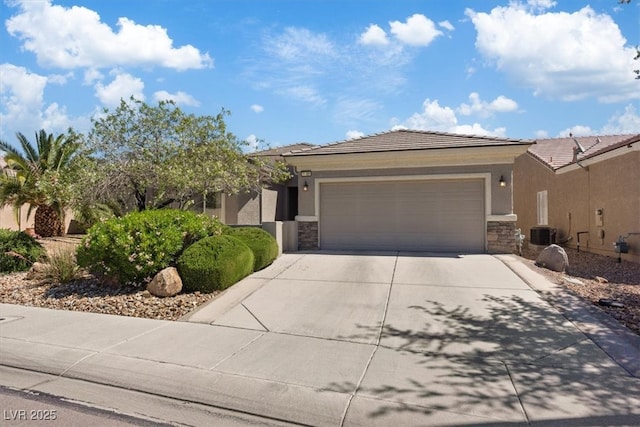 2108 Willow Wren Dr, North Las Vegas, NV 89084 - view of front of house with stone siding, driveway, a garage, and stucco siding
