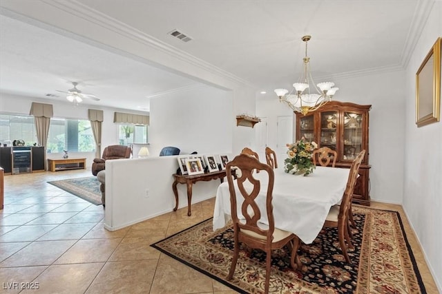 2108 Willow Wren Dr, North Las Vegas, NV 89084 - dining room featuring a chandelier, ornamental molding, ceiling fan, and light tile patterned floors