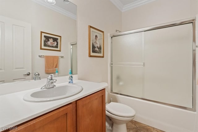 2108 Willow Wren Dr, North Las Vegas, NV 89084 - full bath featuring ornamental molding, toilet, vanity, tile patterned floors, and combined bath / shower with glass door