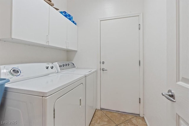 2108 Willow Wren Dr, North Las Vegas, NV 89084 - laundry room featuring washer and clothes dryer, cabinet space, and light tile patterned floors