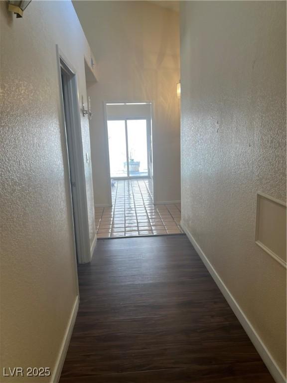 3394 Brookfield Dr, Las Vegas, NV 89120 - hall featuring baseboards, wood finished floors, and a textured wall