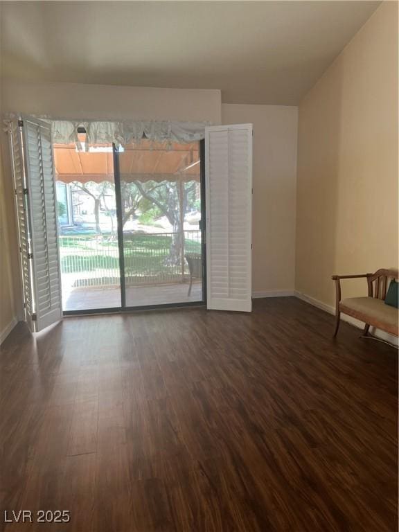 3394 Brookfield Dr, Las Vegas, NV 89120 - spare room with baseboards, dark wood finished floors, and healthy amount of natural light