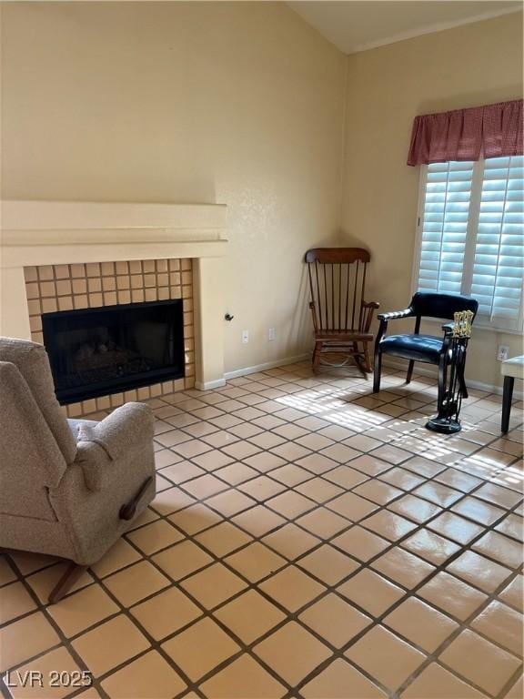 3394 Brookfield Dr, Las Vegas, NV 89120 - sitting room with light tile patterned floors, a fireplace, and baseboards