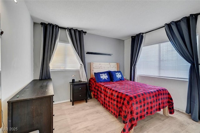 3018 Burnham Ave, Las Vegas, NV 89169 - bedroom featuring multiple windows and wood finished floors