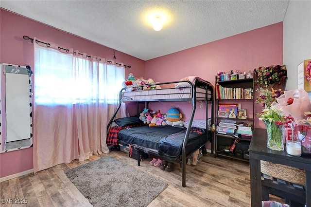 3018 Burnham Ave, Las Vegas, NV 89169 - bedroom with wood finished floors and a textured ceiling