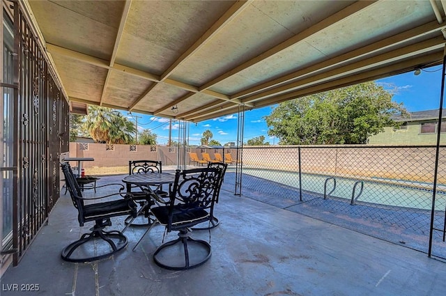 3018 Burnham Ave, Las Vegas, NV 89169 - view of patio / terrace featuring outdoor dining space and fence