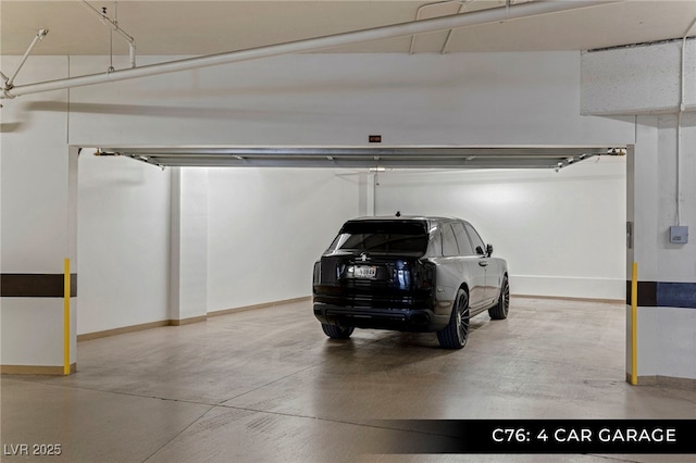 parking garage featuring baseboards