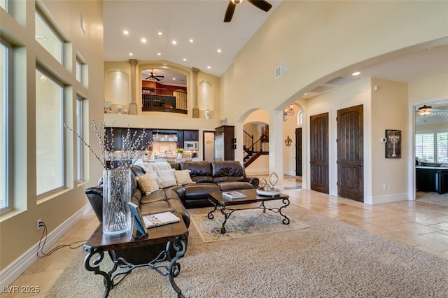 9749 Glistening Brook Ct, Las Vegas, NV 89149 - living area with a ceiling fan, arched walkways, baseboards, recessed lighting, and high vaulted ceiling