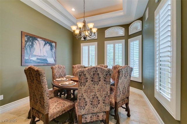 9749 Glistening Brook Ct, Las Vegas, NV 89149 - dining area featuring a chandelier, a raised ceiling, stone tile floors, baseboards, and recessed lighting