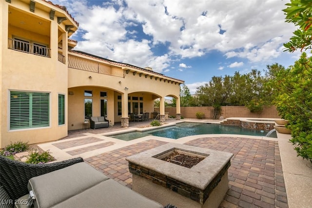 9749 Glistening Brook Ct, Las Vegas, NV 89149 - view of pool with a fire pit, a patio area, a fenced backyard, and a pool with connected hot tub