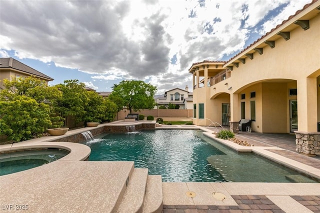 9749 Glistening Brook Ct, Las Vegas, NV 89149 - swimming pool with an in-ground hot tub, a patio area, and a fenced backyard