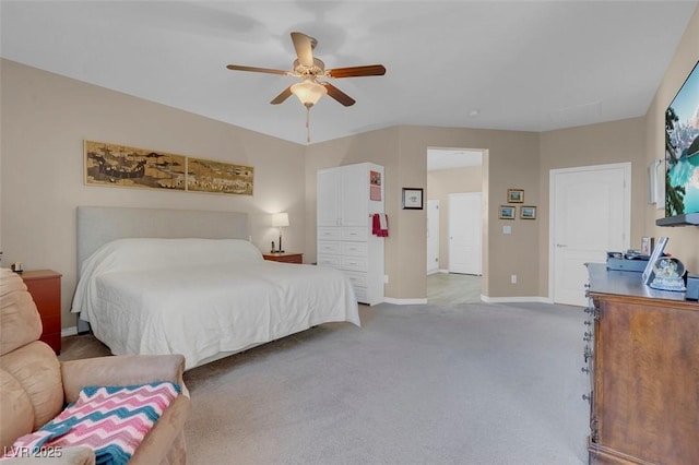 bedroom with light carpet, baseboards, and a ceiling fan