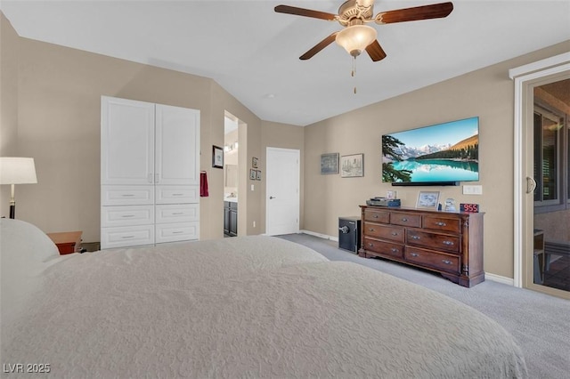 carpeted bedroom with baseboards, ceiling fan, lofted ceiling, ensuite bath, and access to outside
