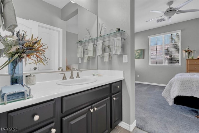 bathroom featuring vanity, a ceiling fan, baseboards, and connected bathroom