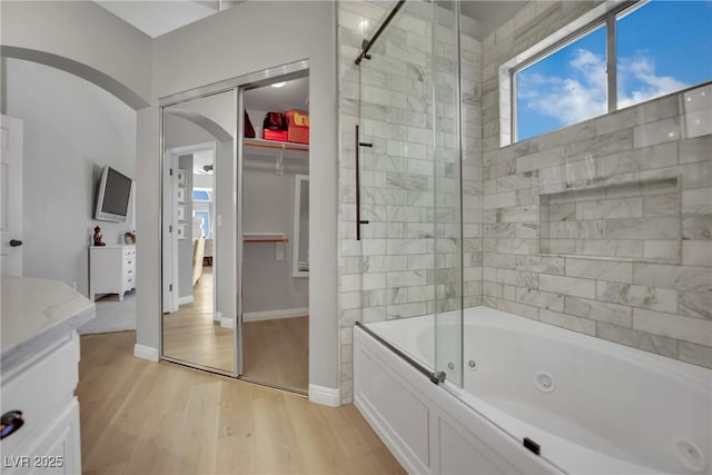 4617 Mancilla St, Las Vegas, NV 89130 - bathroom featuring wood finished floors, vanity, baseboards, and a spacious closet