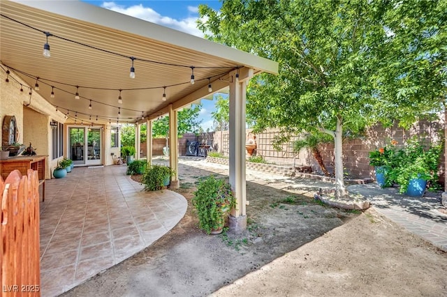 4617 Mancilla St, Las Vegas, NV 89130 - view of patio / terrace with a fenced backyard and french doors