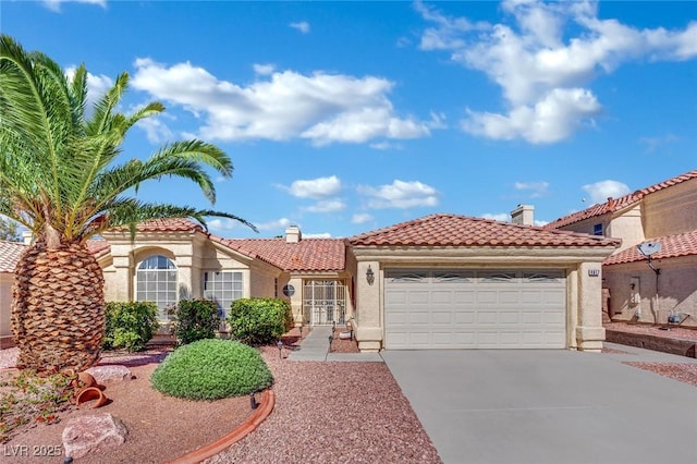 4617 Mancilla St, Las Vegas, NV 89130 - mediterranean / spanish house with a tile roof, stucco siding, concrete driveway, a garage, and a chimney