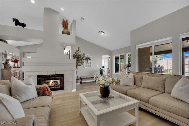 4617 Mancilla St, Las Vegas, NV 89130 - living area featuring a fireplace, recessed lighting, light wood-style flooring, and high vaulted ceiling