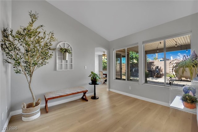 4617 Mancilla St, Las Vegas, NV 89130 - living area featuring wood finished floors, vaulted ceiling, baseboards, and a ceiling fan
