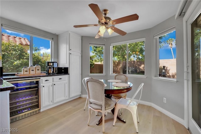 4617 Mancilla St, Las Vegas, NV 89130 - dining room with beverage cooler, light wood finished floors, and ceiling fan