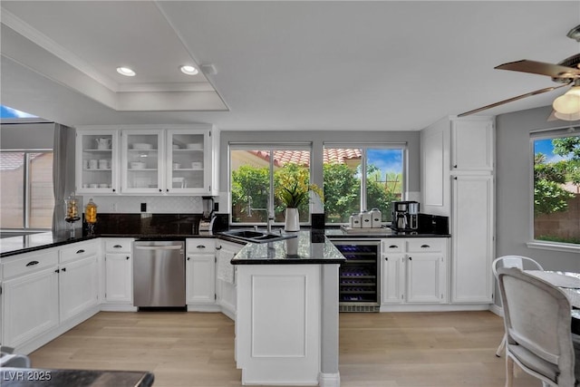 4617 Mancilla St, Las Vegas, NV 89130 - kitchen featuring wine cooler, dishwasher, light wood-style floors, white cabinets, and recessed lighting
