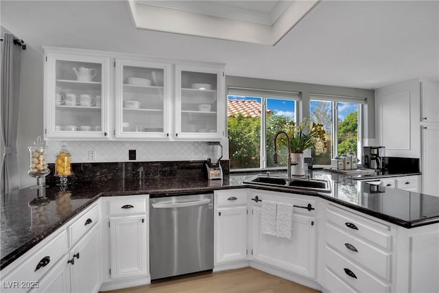 4617 Mancilla St, Las Vegas, NV 89130 - kitchen with stainless steel dishwasher, a sink, white cabinets, and ornamental molding