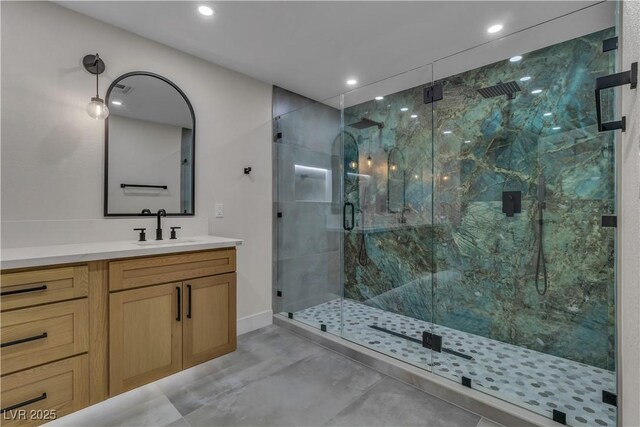 4061 W Eldorado Ln, Las Vegas, NV 89139 - bathroom with a marble finish shower, recessed lighting, vanity, and baseboards
