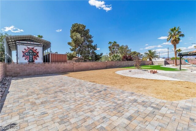 4061 W Eldorado Ln, Las Vegas, NV 89139 - view of patio / terrace featuring a fenced backyard and a detached carport